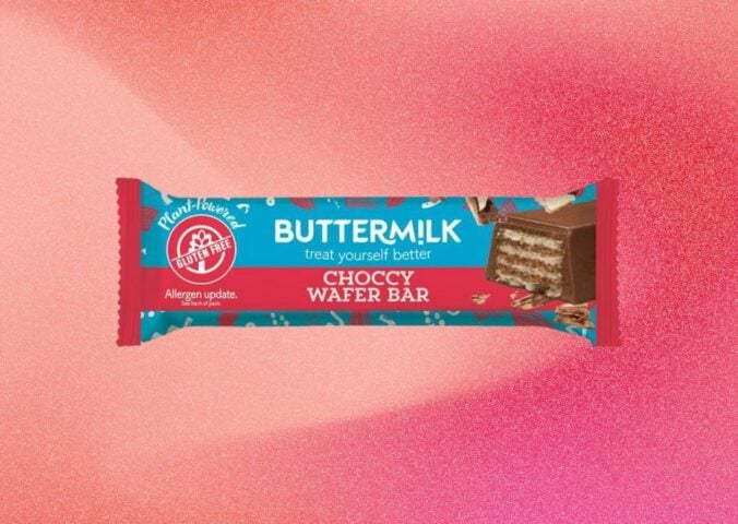 A bar of Buttermilk wafer chocolate bar in front of a light red background