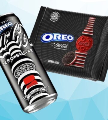 A packet of Coca Cola flavored Oreos in front of a blue background