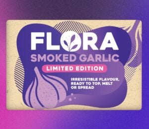 A pack of Flora dairy-free garlic butter in front of a purple background