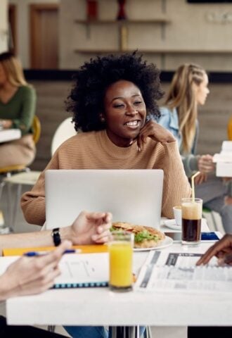 Students eating meat-free meals in a cafeteria