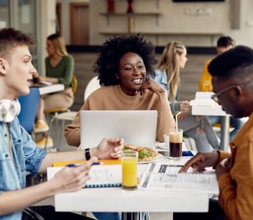 Students eating meat-free meals in a cafeteria