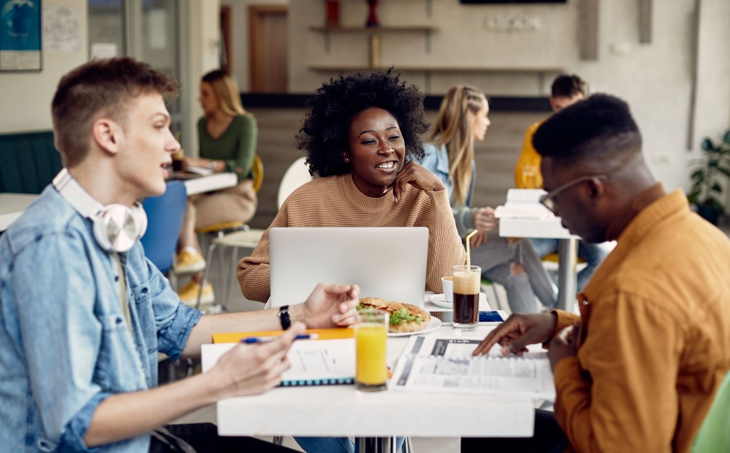 Students eating meat-free meals in a cafeteria