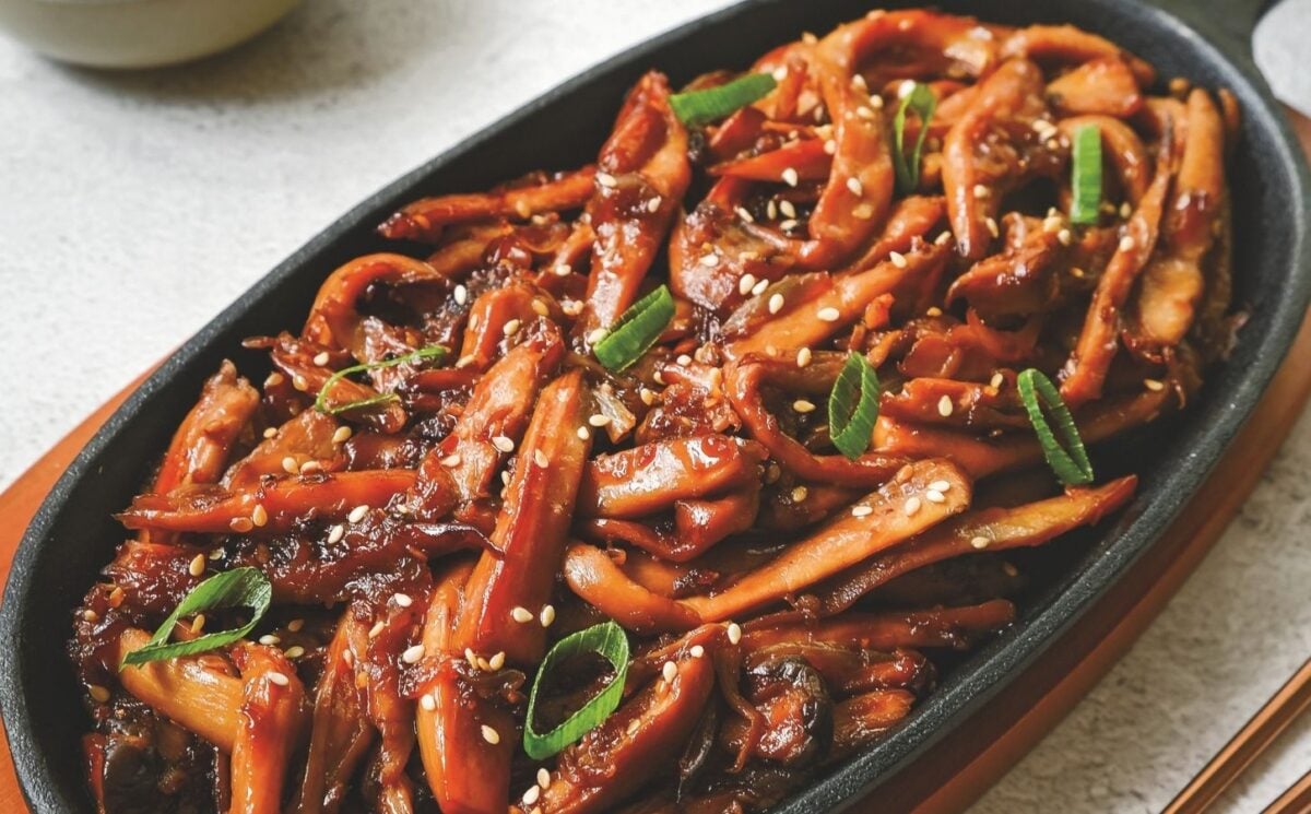 a picture of Korean bulgogi mushrooms made with king oyster mushrooms, and served with rice and vegan kimchi