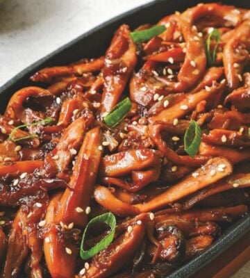 a picture of Korean bulgogi mushrooms made with king oyster mushrooms, and served with rice and vegan kimchi