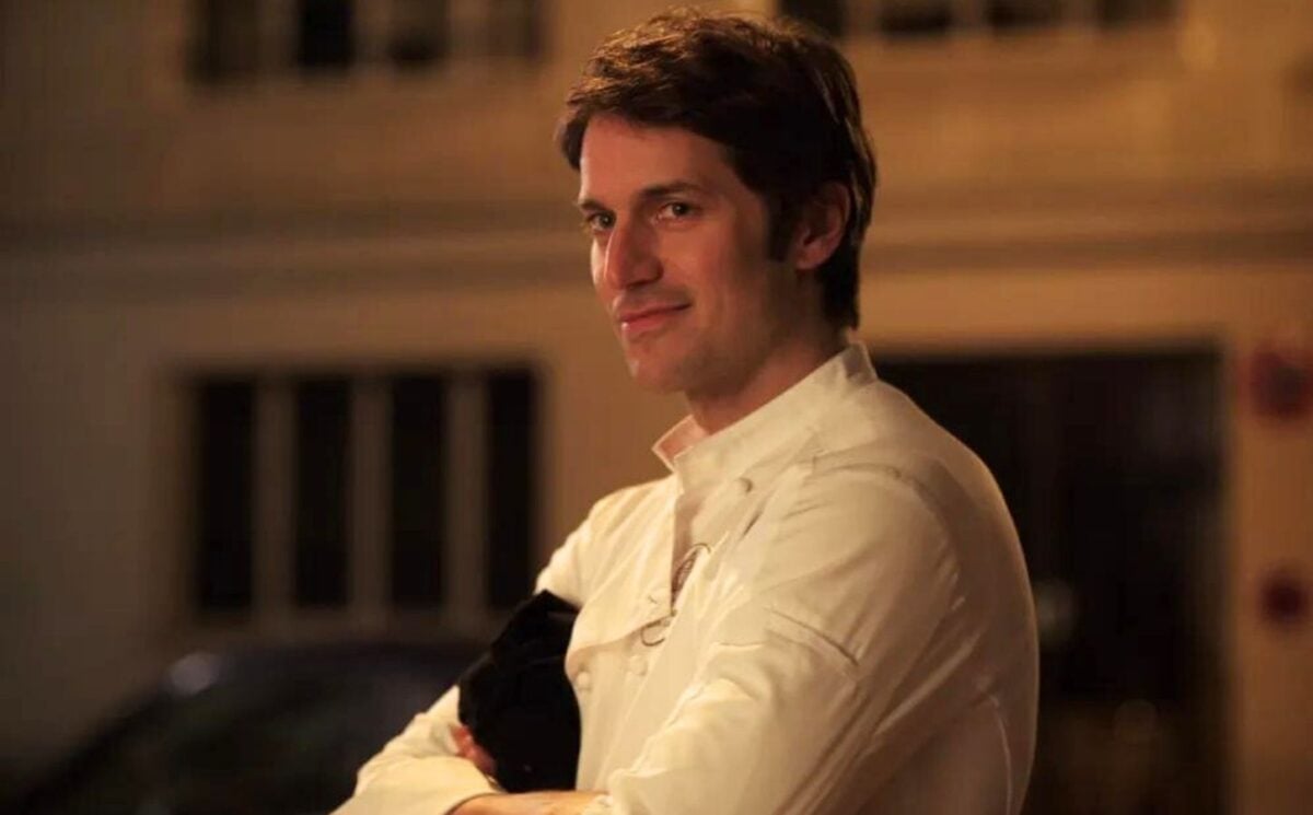 A still of Lucas Bravo's character Gabriel wearing his chef uniform in Netflix show Emily in Paris