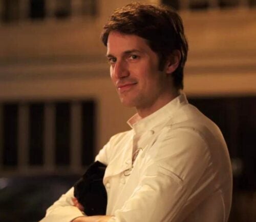 A still of Lucas Bravo's character Gabriel wearing his chef uniform in Netflix show Emily in Paris