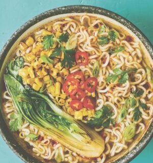 a picture of a pimped instant ramen bowl with sweetcorn, bak choy, and chili