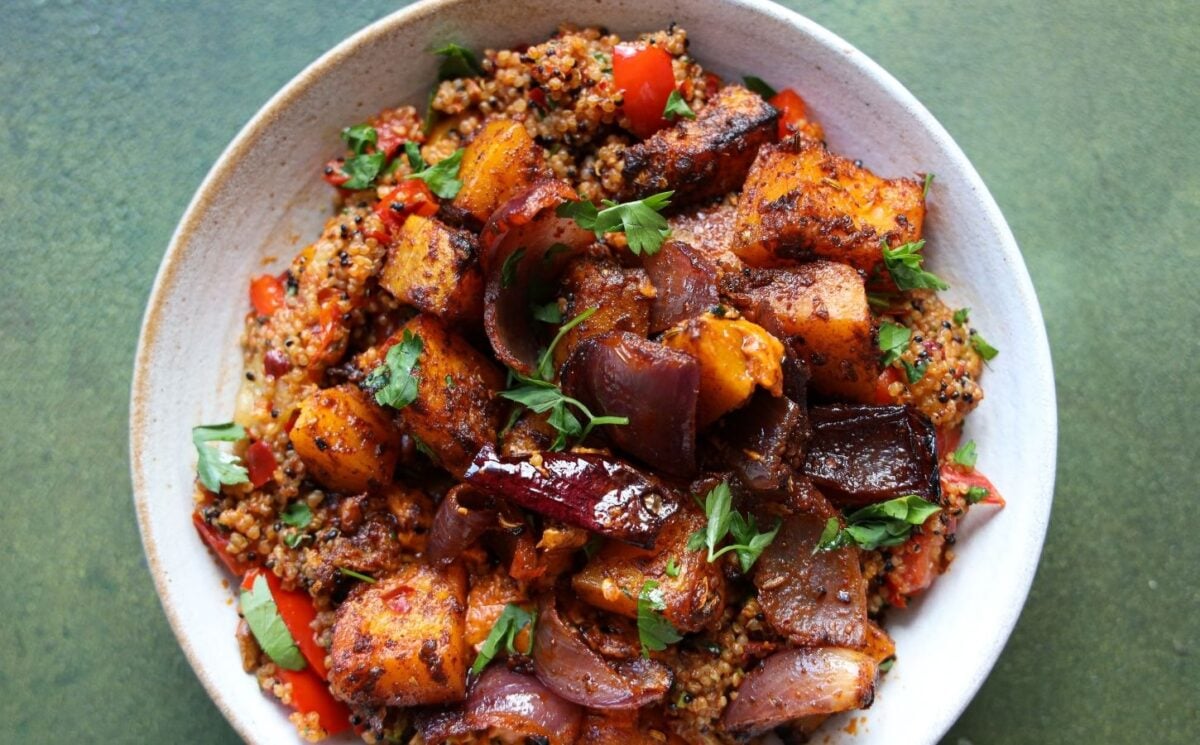 a picture of a speedy squash bowl with butternut, quinoa, tomato, harissa, onion, and red pepper