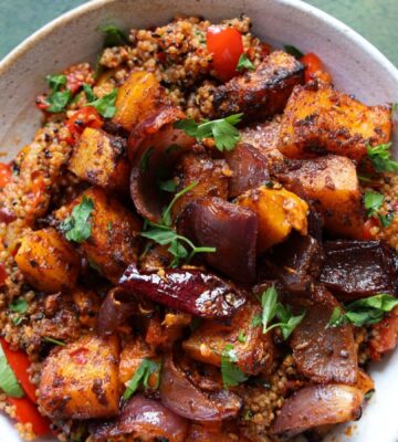 a picture of a speedy squash bowl with butternut, quinoa, tomato, harissa, onion, and red pepper