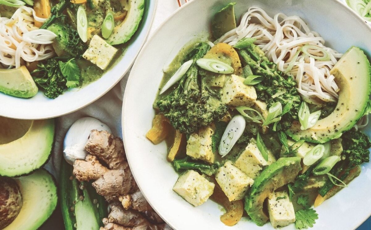 A bowl of high protein vegan avocado noodles complete with tofu, broccoli, and peppers