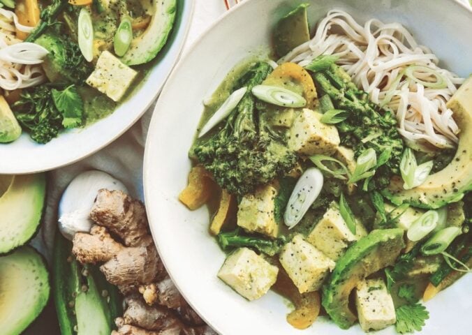 A bowl of high protein vegan avocado noodles complete with tofu, broccoli, and peppers