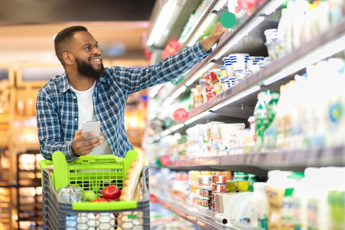 Man shopping for dairy and supermarket