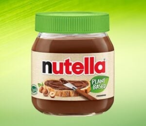 A product image of Nutella Plant-Based in front of a green background