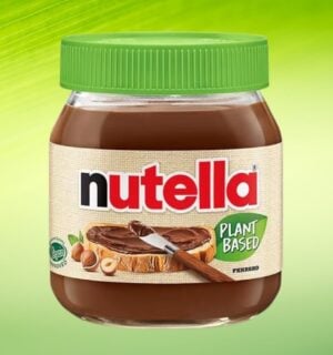 A product image of Nutella Plant-Based in front of a green background