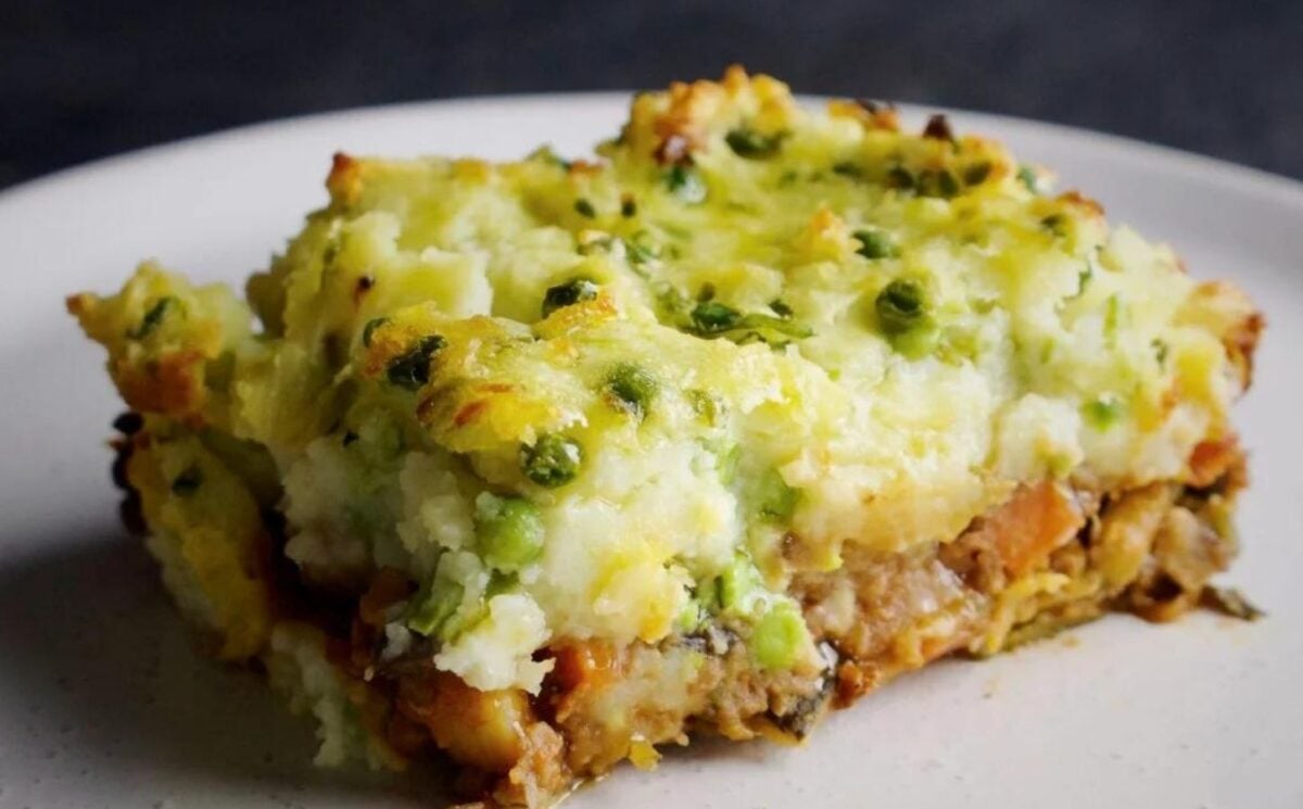 a picture of a slice of vegan shepherd's pie made with frozen pea an potato mash