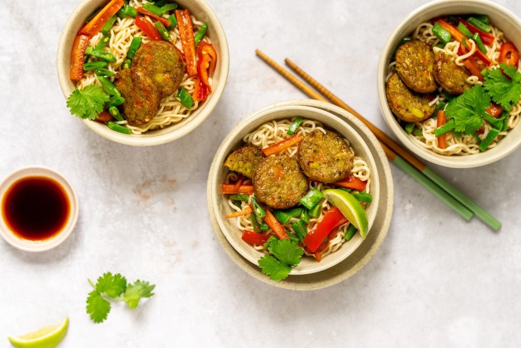 Three bowls of noodles with Vivera whole foods protein bites