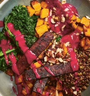 a picture of an autumn everything bowl with yogurt beet sauce