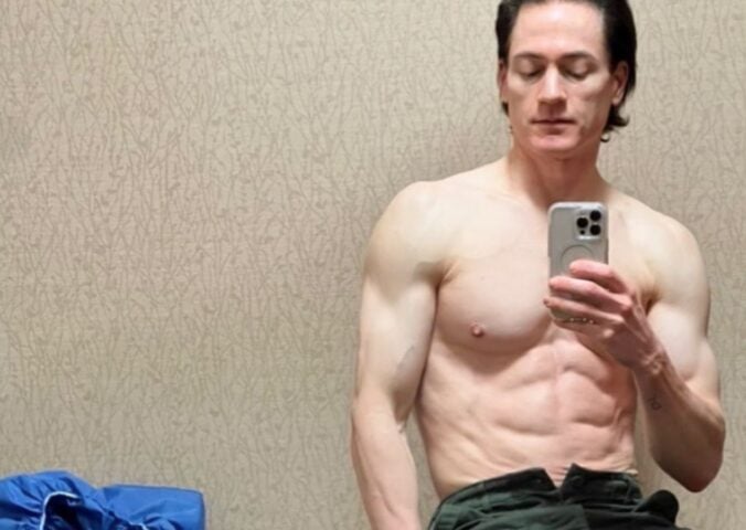 Longevity expert Bryan Johnson taking a topless mirror selfie