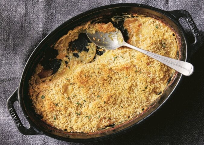 a picture of a vegan cheesy butternut squash and potato bake made with nutritional yeast and vegan bechamel sauce