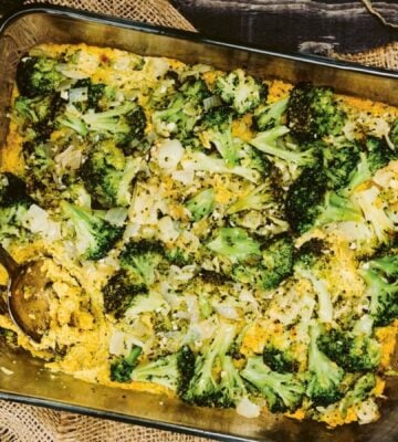 a picture of a vegan cheesy broccoli bake made with silken tofu, nutritional yeast, paprika, and tahini