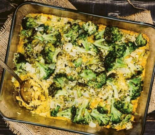 a picture of a vegan cheesy broccoli bake made with silken tofu, nutritional yeast, paprika, and tahini