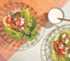 a picture of falafel-pear lettuce wraps with cumin pears, garlic tahini, chickpea and fava bean falafel, and butter lettuce