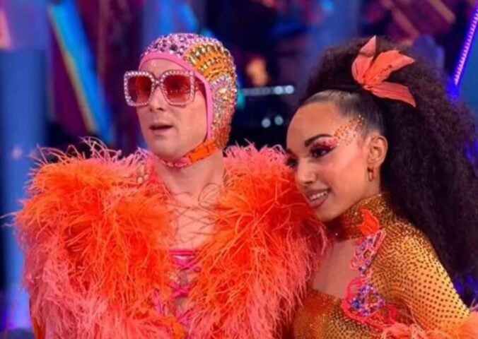 Two contestants wearing feather outfits on BBC show Strictly Come Dancing