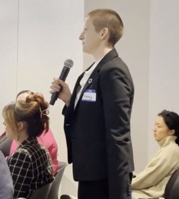 A woman confronting an animal agriculture panel for greenwashing at NY Climate Week