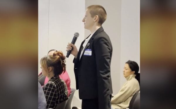 A woman confronting an animal agriculture panel for greenwashing at NY Climate Week