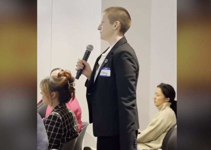 A woman confronting an animal agriculture panel for greenwashing at NY Climate Week