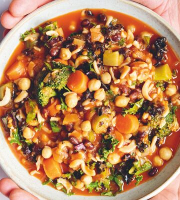 an Ikarian longevity stew filled with beans, chickpeas, lentils, kale, broccoli