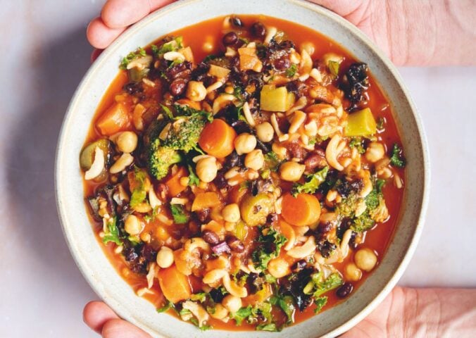 an Ikarian longevity stew filled with beans, chickpeas, lentils, kale, broccoli