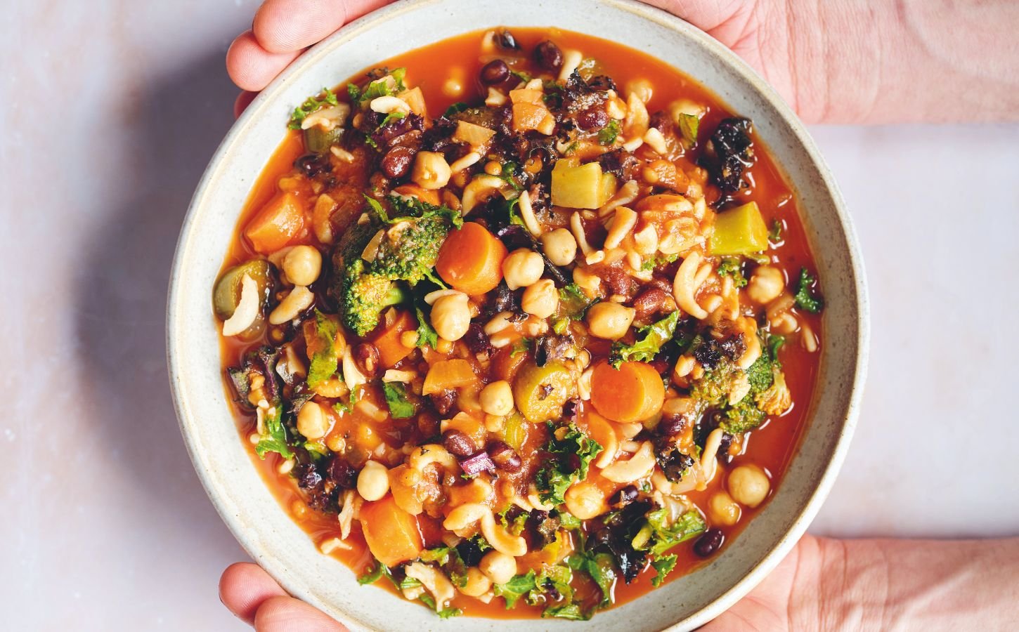 an Ikarian longevity stew filled with beans, chickpeas, lentils, kale, broccoli