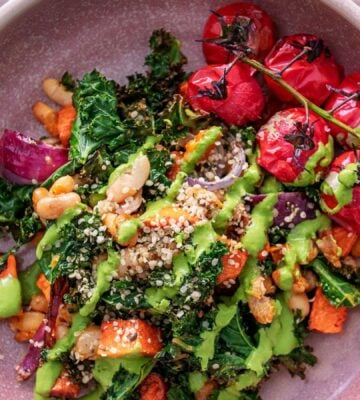 a picture of a kale and sweet potato hash with tomato and beans