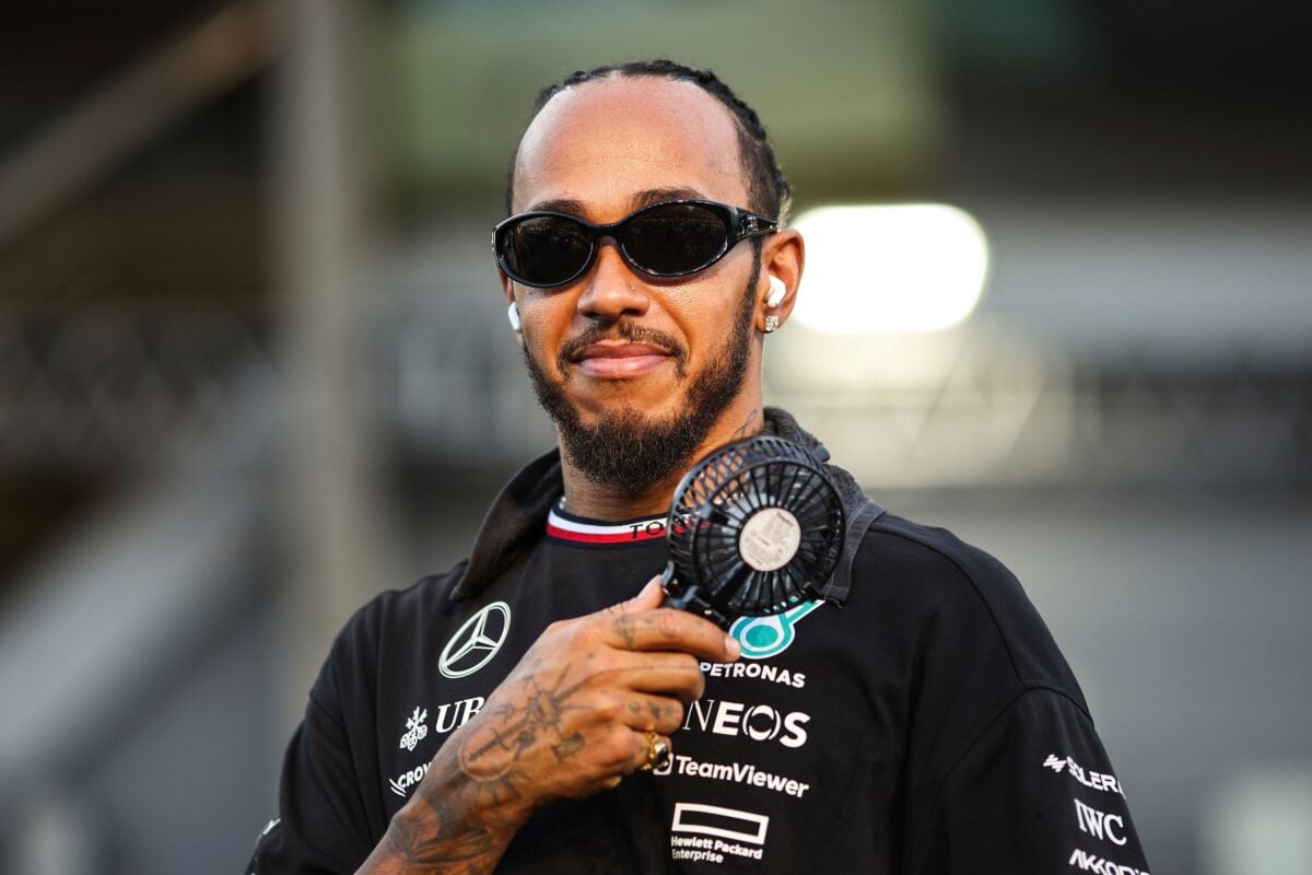 Vegan celebrity and F1 driver fanning himself on the racing track