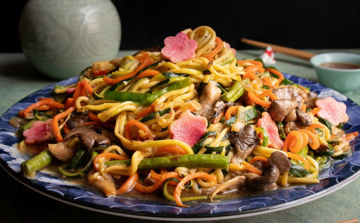 a picture of zucchini noodles paired with vegetables and a tasty sauce