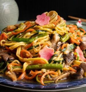 a picture of zucchini noodles paired with vegetables and a tasty sauce