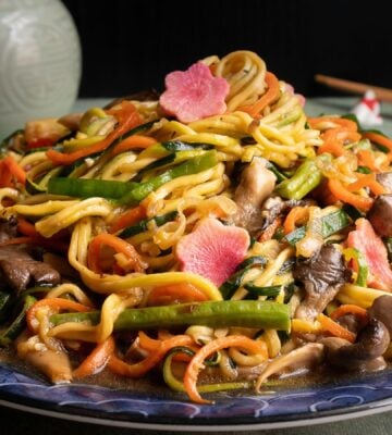 a picture of zucchini noodles paired with vegetables and a tasty sauce