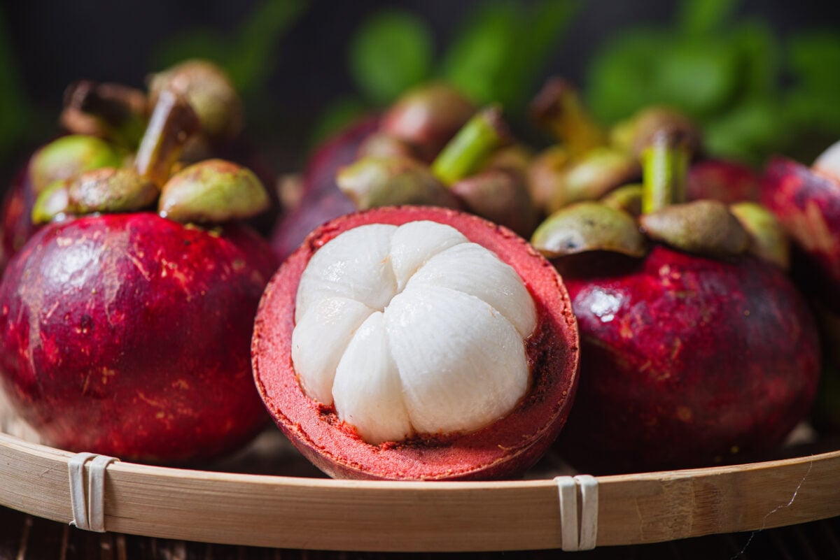 A tray full of mangosteen fruits