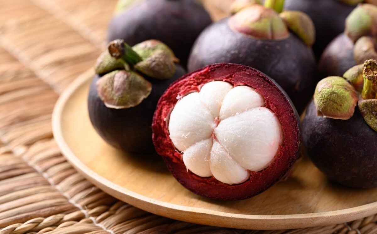 A selection of Mangosteen fruits on a plate