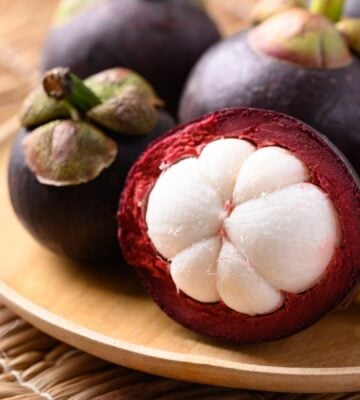 A selection of Mangosteen fruits on a plate