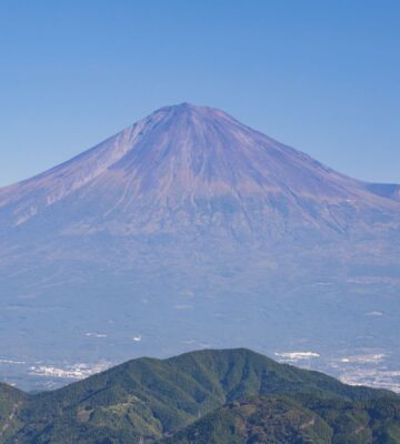 Photo shows the peak and slopes of Japan's Mount Fuji, which are still without their annual snow cap