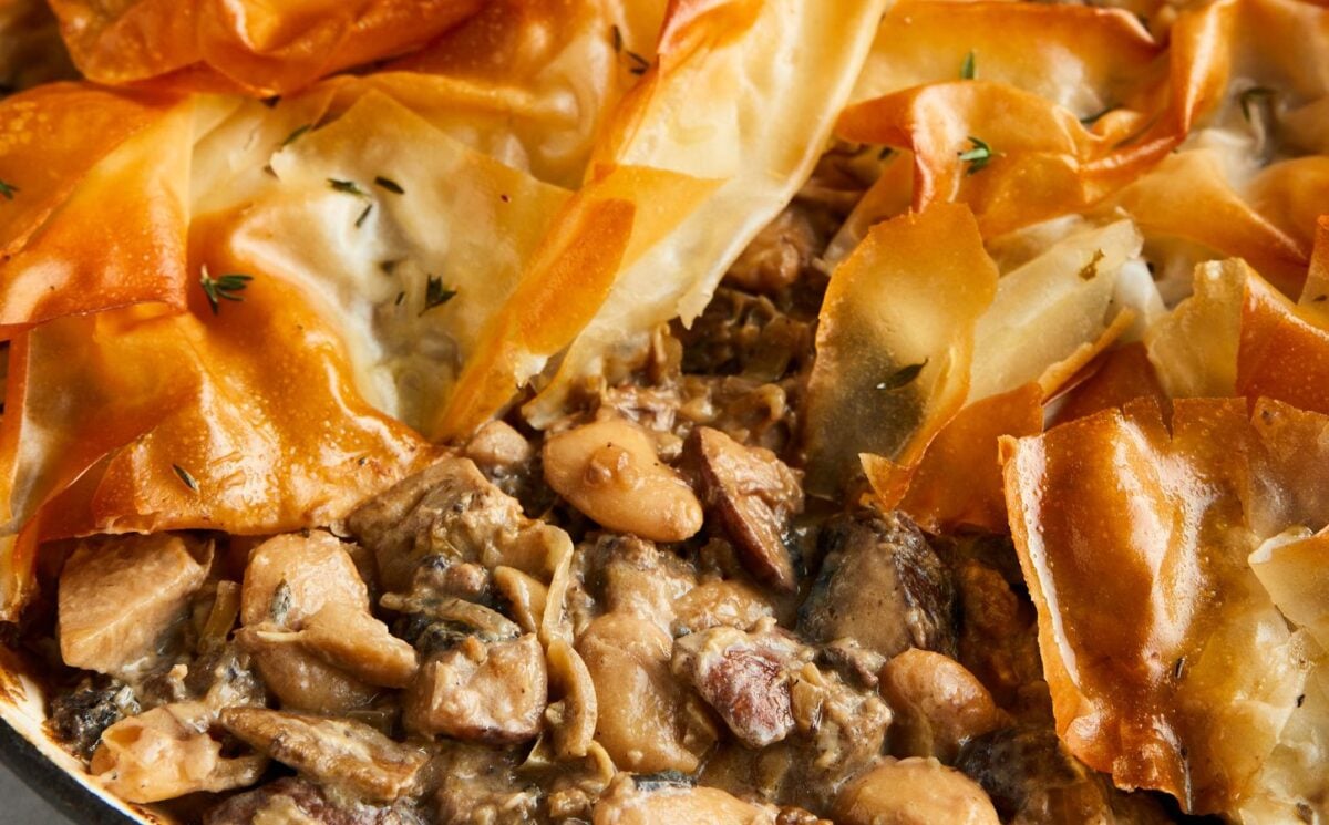 a picture of a mushroom and butterbean filo pie made with artichokes and banana shallots