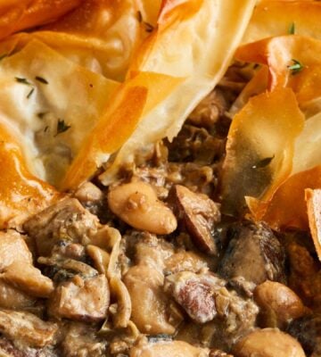 a picture of a mushroom and butterbean filo pie made with artichokes and banana shallots