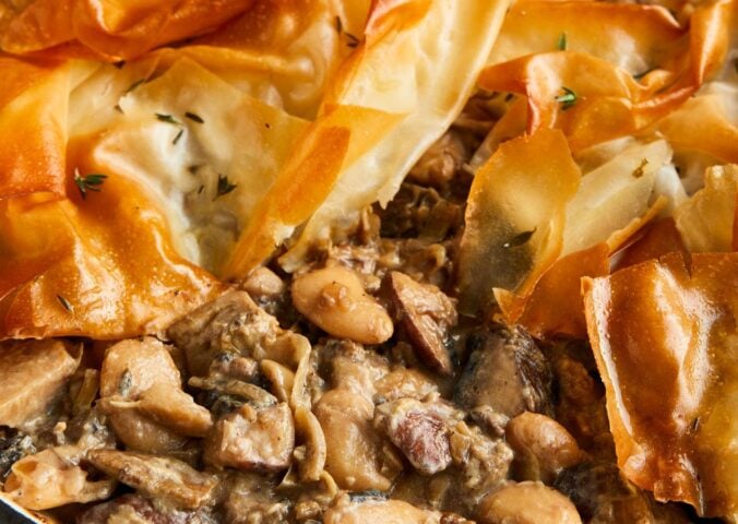 a picture of a mushroom and butterbean filo pie made with artichokes and banana shallots