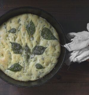 a picture of a perilla leaf focaccia in a cast iron skillet