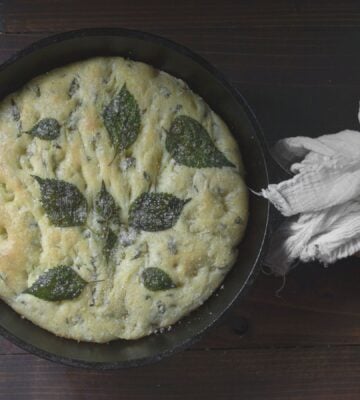 a picture of a perilla leaf focaccia in a cast iron skillet