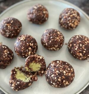 A plate of pistachio energy balls made to a vegan recipe