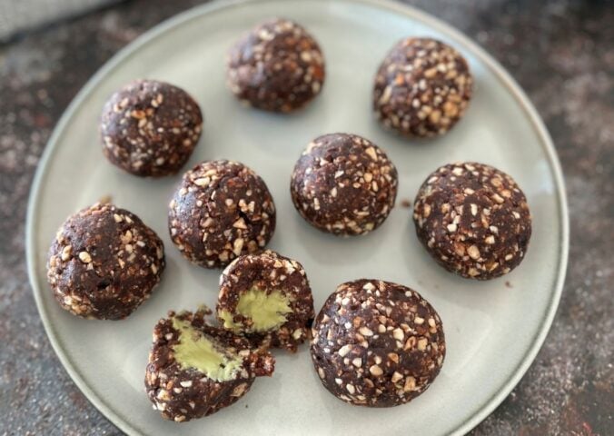 A plate of pistachio energy balls made to a vegan recipe