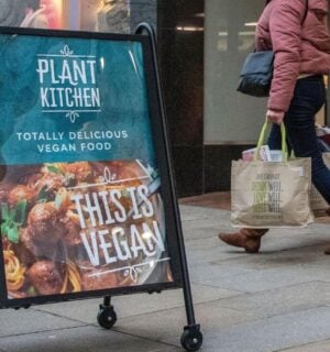 A sign outside M&S advertising its Plant Kitchen range reading "This is vegan"